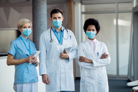 three healthcare workers wearing masks