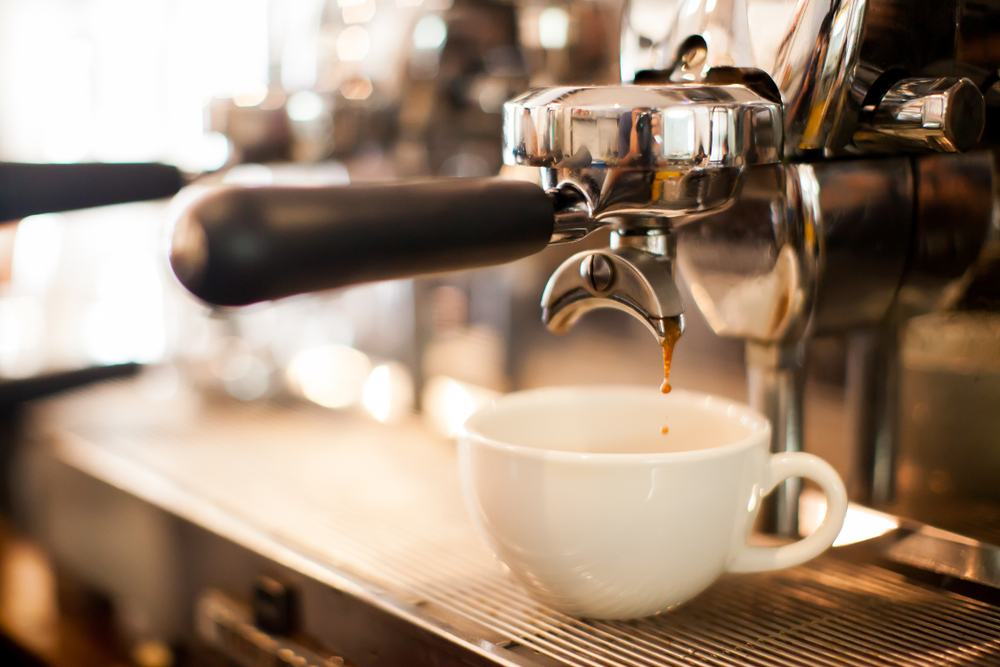 a cup of espresso being freshly made