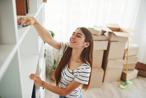 woman cleans her apartment